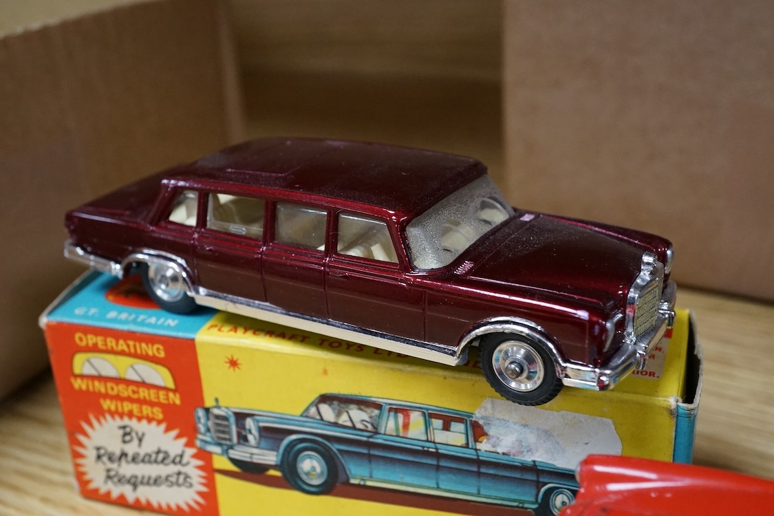 Three boxed Corgi Toys; a Mercedes-Benz 600 Pullman (247) in metallic maroon, a Chevrolet Impala (220), in sky blue with red interior, and an Aston Martin DB4 (218) in red with yellow interior. Condition - good, some dam